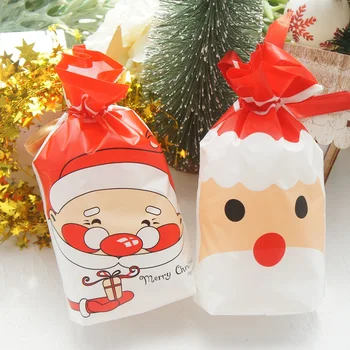 23.5*14.5 cm 50tk Punane Jõulud Jõuluvana Põder Lumememm Disain Kott jõulupidu Kingitus Plastikust Pakendi Kotid Lindiga